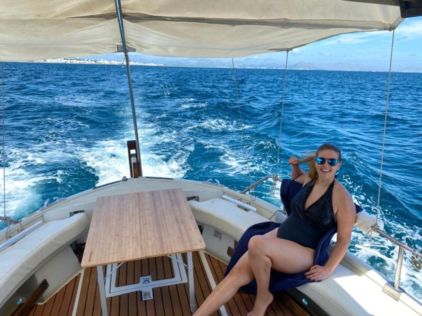 Alcudia: Traditional Wooden Boat Trip with Snorkeling - The Alcanada lighthouse and second swim