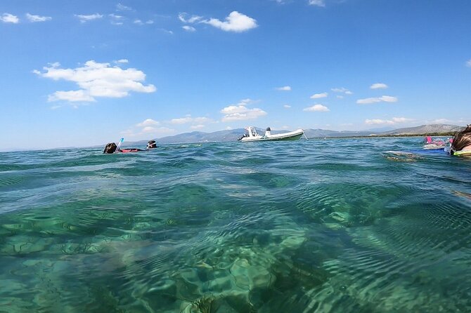 Athens, Nea Makri: Guided Small Group Snorkeling Boat Excursion - Getting fitted with gear before entering the water