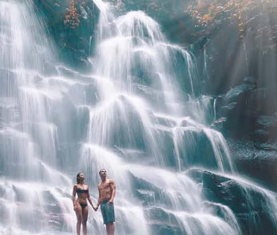 Bali: Blue Lagoon Snorkeling & Waterfall Tour with Lunch - Kanto Lampo Waterfall and the famous rock photo