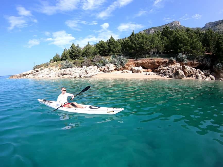 Bol: Zlatni Rat Beach Kayak Tour with Snorkeling - Meeting the guide beside the orange and blue flags
