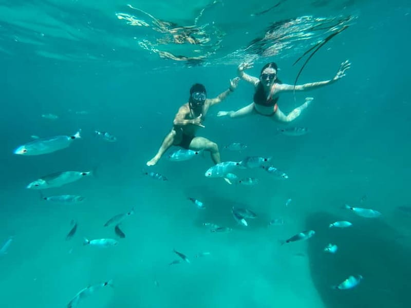 Cagliari: Boat Tour with 4 Swim Stops, Snorkeling & Prosecco - Sella del Diavolo and the Poetto coast