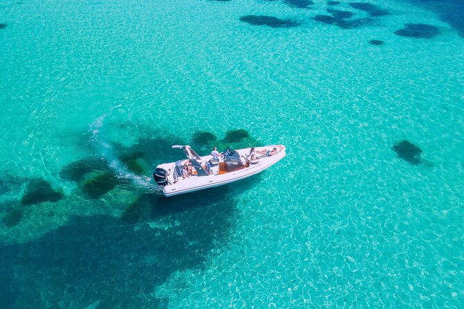 Cagliari Boat Tour with Sardatrips; Swim, Snorkeling, Sip & Snack - Cala Fighera, blue water below the limestone cliffs