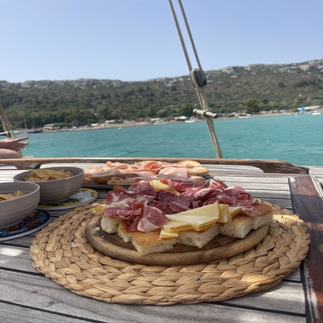 Cagliari: Boat Tour with Swim Stops, Snorkeling, & Aperitif - Cala Bernat starts the swimming