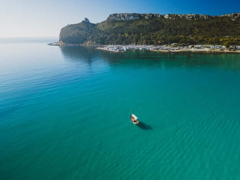 Cagliari: Gozzo Tour with 3 Swim Stops, Snorkel & Local Food - Cala Bernat: the first coastal look