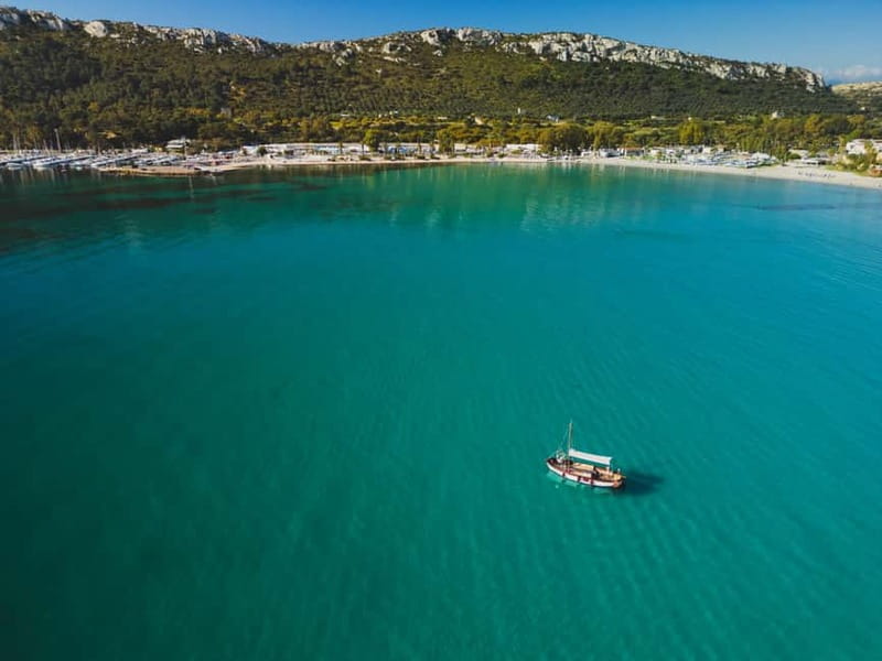 Cagliari: Gozzo Tour with 3 Swim Stops, Snorkel & Local Food - A traditional gozzo with room for a relaxed morning