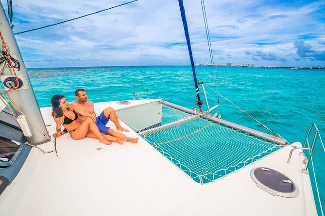 Catamaran to Isla Mujeres Snorkeling Tour with Open Bar and Lunch - Spinnaker rides and the open-bar atmosphere