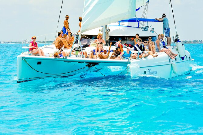 Catamaran to Isla Mujeres Snorkeling Tour with Open Bar and Lunch - The return sail and sunset promise