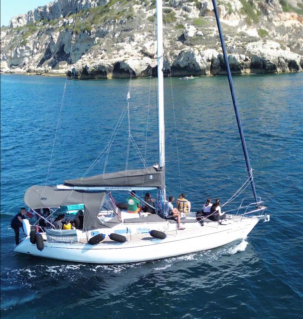 Catamaran tour, swimming, snorkeling, and a Prosecco toast - Passing Grotta dei Colombi toward the Devils Saddle