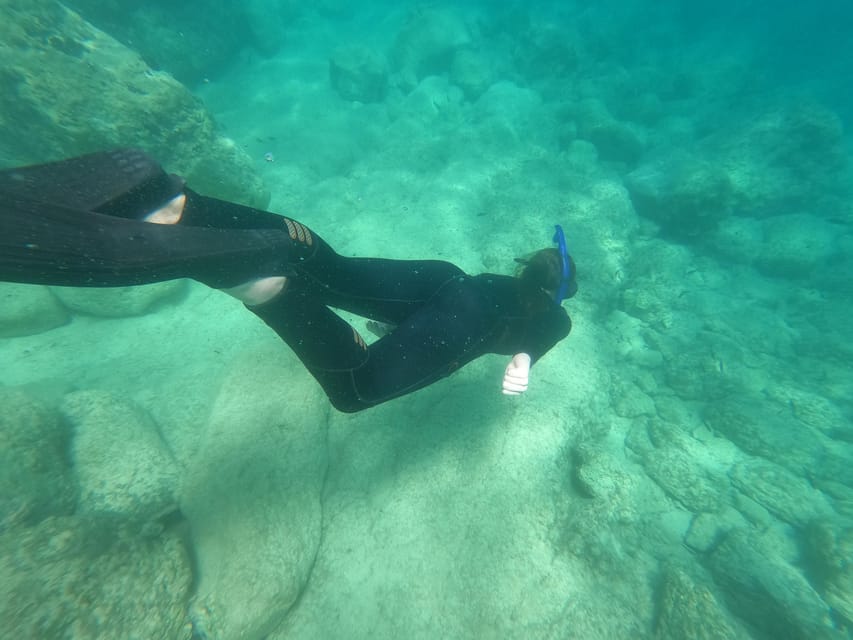 Chania: Boat Trip with Guided Snorkeling Tour - First snorkeling stop: 45 minutes of guided exploration