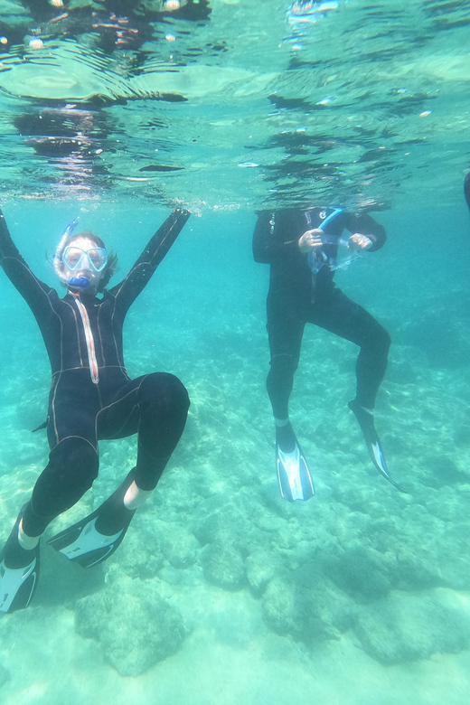 Chania: Boat Trip with Guided Snorkeling Tour - Fruit, water, and a welcome pause between stops