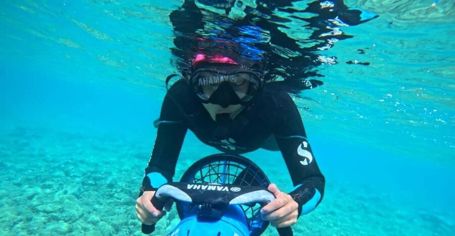 Chania: Sea Scooter Snorkeling boat tour - Moving between stops in Souda Bay