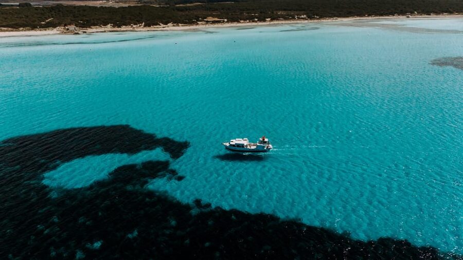 Colònia de Sant Jordi: Es Trenc Boat Tour with Snorkeling - The crew, music, and onboard atmosphere