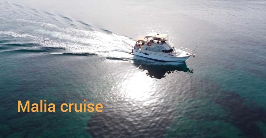 Crete: Snorkeling Boat Trip with Lunch and Transfer - Cruising past Stalis and Hersonissos