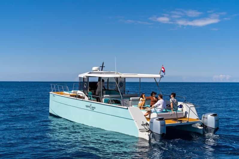 Dubrovnik: Blue Cave Catamaran Tour with Drinks and Snorkel - Drinks, music, and comfort on deck