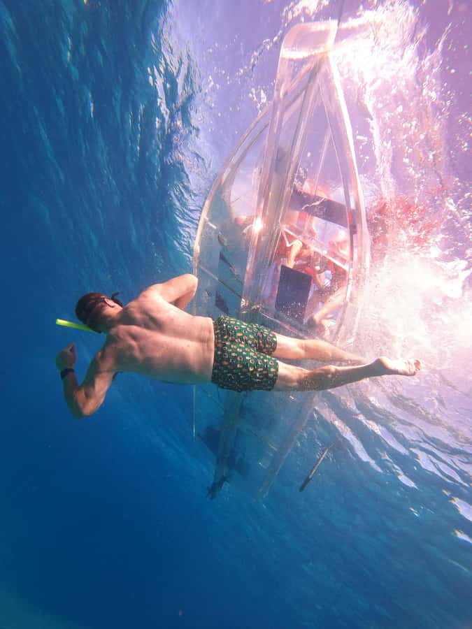 From Cozumel: Invisible Boat Snorkeling Tour - Looking through Cozumel’s transparent hull