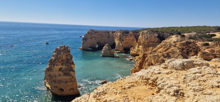 From Faro: 7 Valleys Hiking, Benagil Cave, & Snorkeling Tour - Marinha Beach and its heart-shaped arch