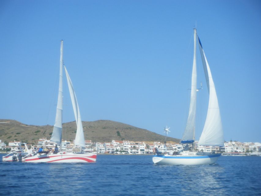 From Fornells: Half-Day Menorca Catamaran Trip w/ Snorkeling - Snacks and unlimited drinks at sea