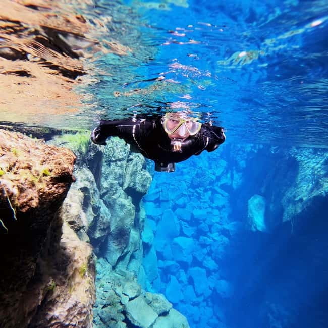 From Reykjavík: Silfra Snorkeling with free photos - Getting into the dry suit