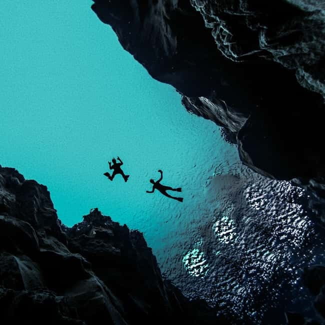 From Reykjavík: Silfra Snorkeling with free photos - The short swim through clear glacial water