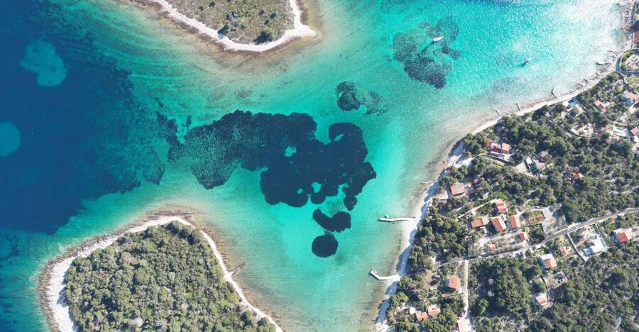 From Split: Trogir & Blue Lagoon Boat Tour with Snorkeling - Krknjaši Blue Lagoon, clear water with a weather caveat