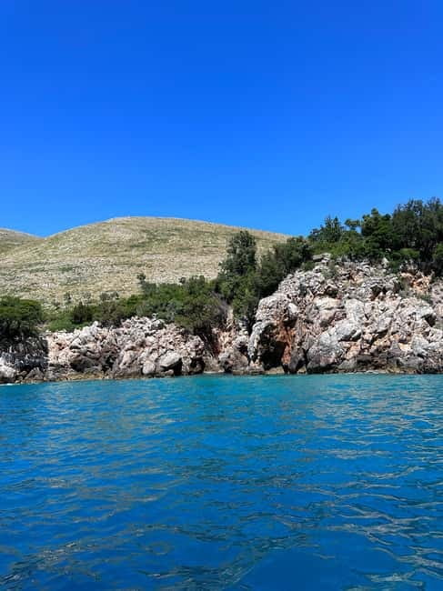 From Vlore: Haxhi Ali Cave Speedboat Tour with Snorkeling - How the guides and languages affect the experience