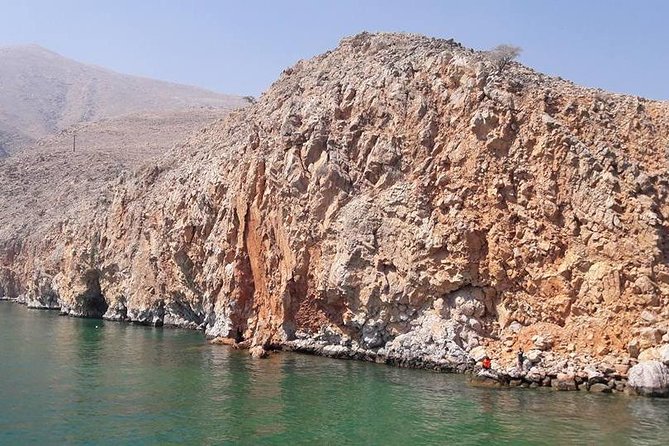 Full Day Musandam Cruise with Lunch and Snorkelling from Dubai - Boarding the carpeted wooden dhow