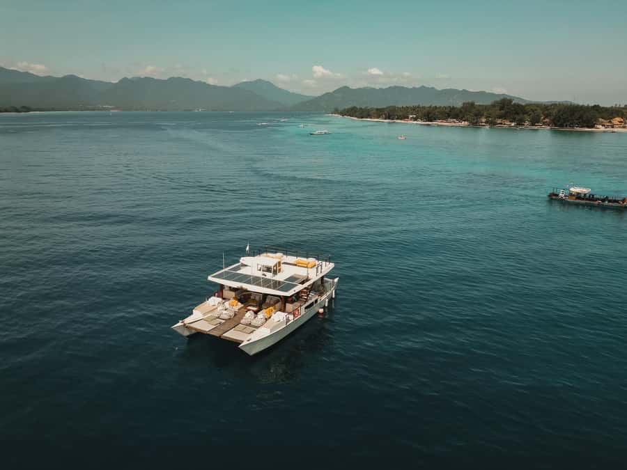 Gili Islands: 4-in-1 Catamaran Snorkeling Experience - Paddleboards, floats, and the roof jump