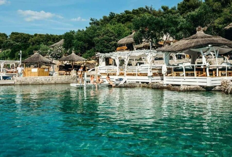 Hvar: Private Sailing Boat Trip with Swimming and Snorkeling - Sailing out from Hvar’s Riva 27