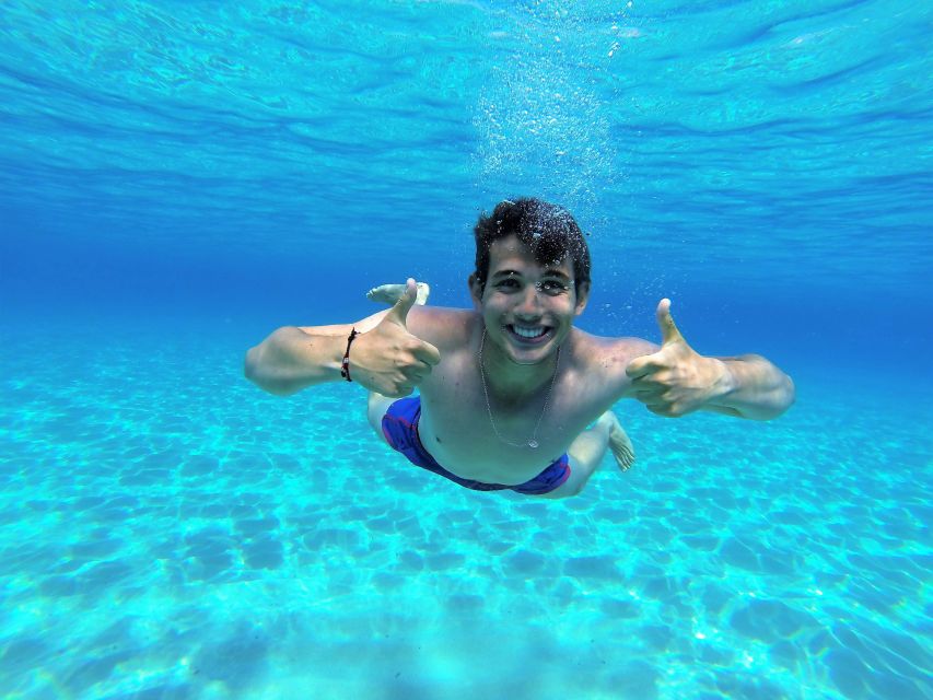 Ibiza: Sea Caves & Coves Snorkeling Paddle Boarding Tour - The first cruise and the sea cave area