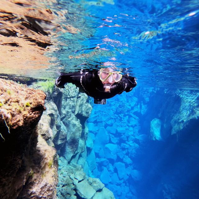 Iceland: Silfra Snorkeling Tour and Sky Lagoon Spa Combo - Making the jump from cold water to Sky Lagoon