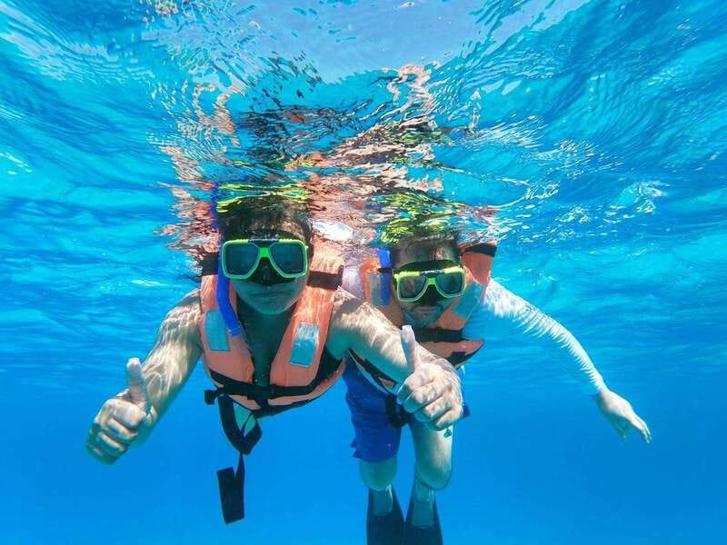Isla Mujeres: Catamaran with Open Bar, Snorkeling and Lunch - Sailing south with music, drinks, and a party mood