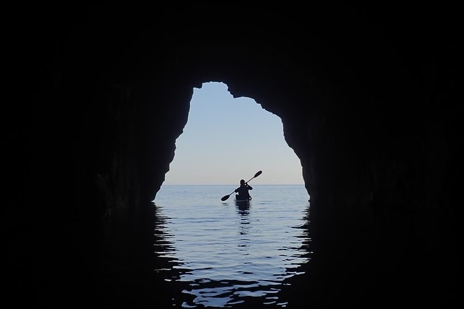 Kayak and snorkel excursion to Cova Tallada - Inside Cova Tallada with a lantern