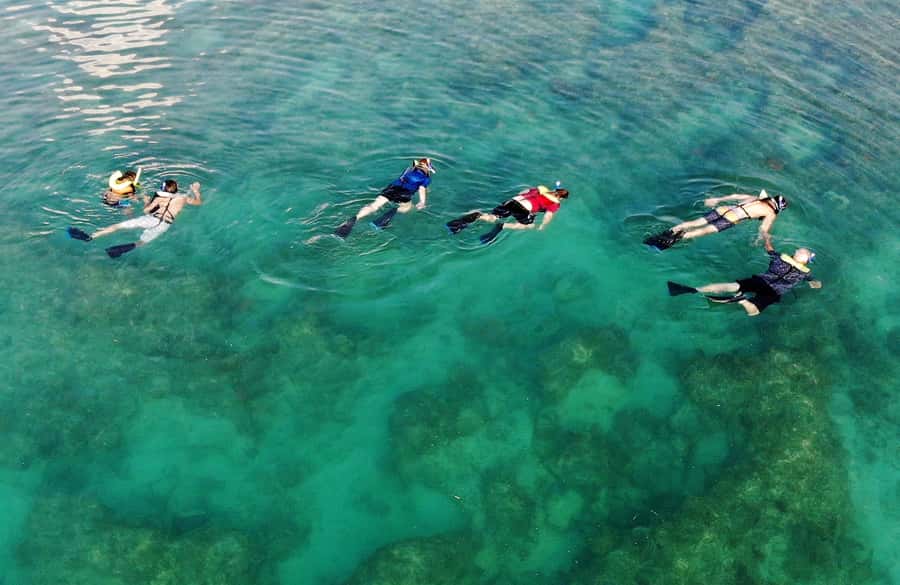 Key West: Reef Snorkel Morning Tour with Breakfast & Mimosas - The return trip, beer, and coastal views