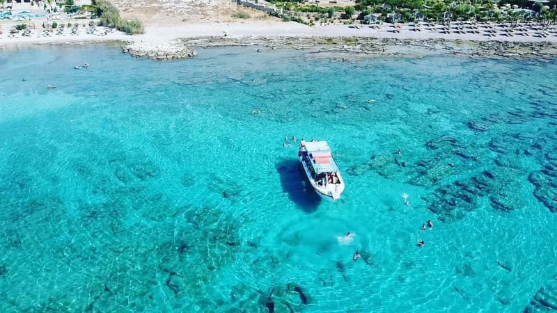 Lindos: Glass Bottom Boat Tour with Snorkeling - The cruise past Cleovoulos Tomb and Lindos Caves