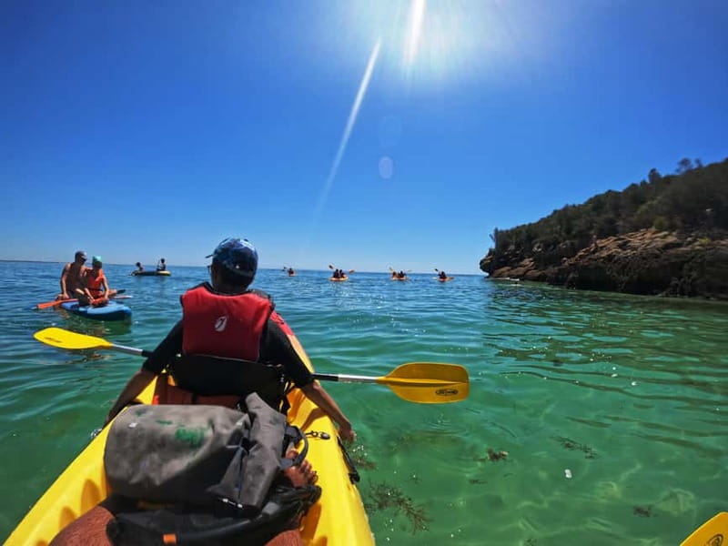 Lisbon: Kayaking & Snorkeling Tour with photos included - Sea caves, small beaches, and the weather question