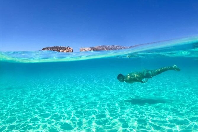 Malta: Comino, Blue Lagoon & Caves - swim, snorkel & slide - Cruising around Comino’s cliffs