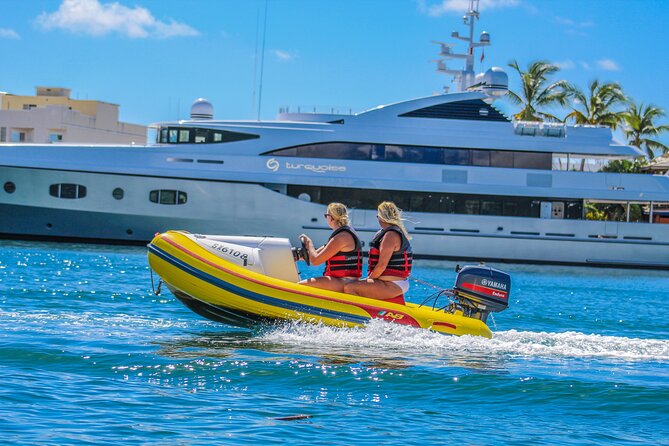 Mini-Speed Boat 3 Hour Snorkeling Adventure - Crossing Simpson Bay Lagoon beside the yachts