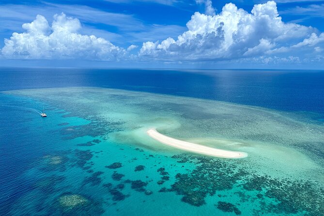 Outer Reef Mackay Cay Sail & Snorkel Adventure from Port Douglas - The glass-bottom boat and coral cay visit