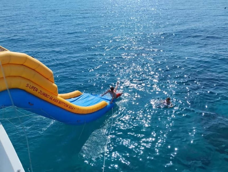 Paphos: Glass Bottom Boat Trip with Swimming or Snorkeling - What the crew adds to the outing