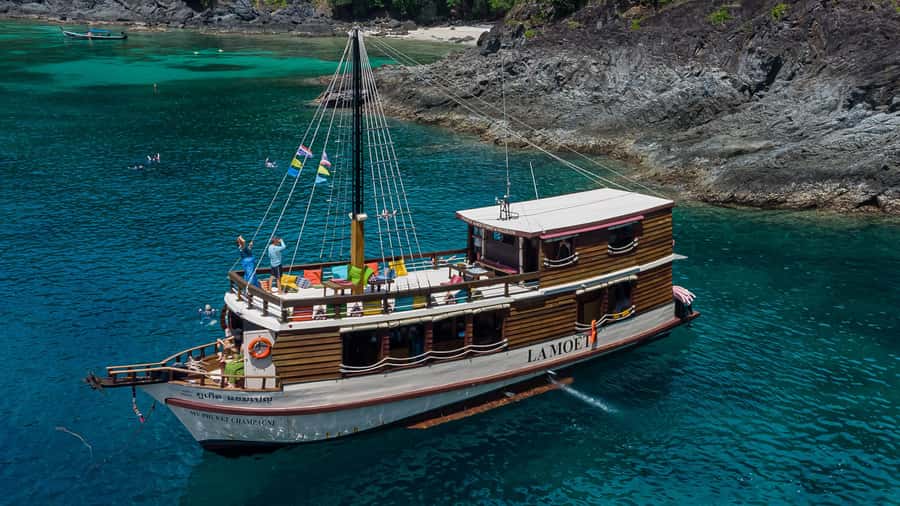 Phuket: Escape the crowds on relaxing boat (Snorkelling) - Cruising past Rawai and the southern coast