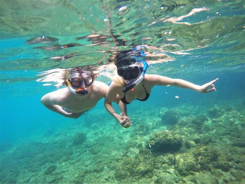 Pula: Cave Kayak Tour, Snorkeling and Island Jumping - Paddling the Pula coast toward the cave