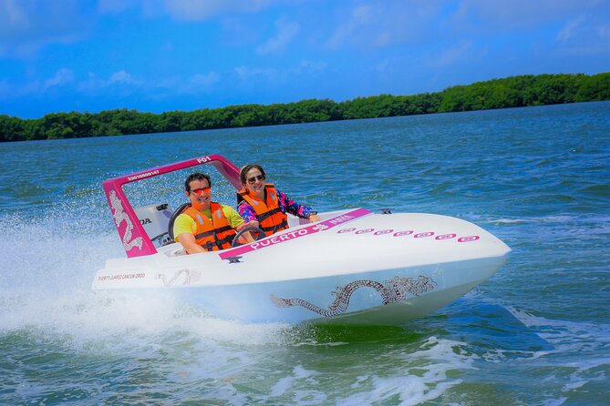 Reef Snorkeling & Jungle Speedboat Adventure with Mayan Ceremony - Driving your own boat through Nichupte Lagoon