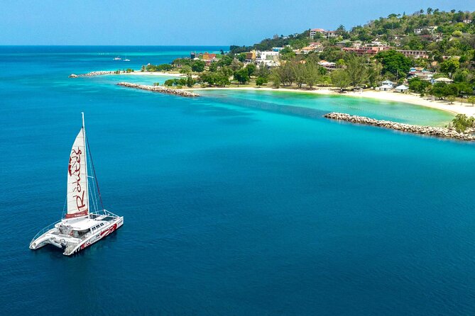 Reggae Catamaran and Snorkeling Open Bar Cruise Montego Bay - Reggae, cocktails, and Jamaican-style snacks