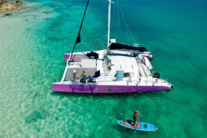 Restless Native Catamaran Sail and Snorkel Tour - Kayaks and paddleboards keep the cove from feeling passive