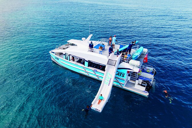 Ride & Slide by South Sea Cats - Half Day Snorkelling Trip - Sliding from a high-speed catamaran into the Mamanuca sea