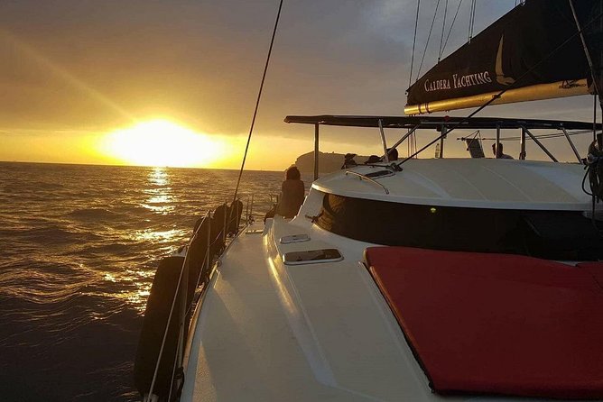 Santorini: Adventurous Catamaran Experience with Snorkeling - The Akrotiri Lighthouse adds a quieter coastal view