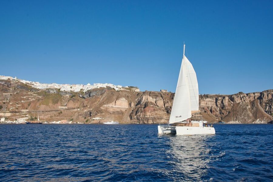Santorini Gold Catamaran Cruise with Snorkel, BBQ & Open Bar - Sunset, music, and the ride back