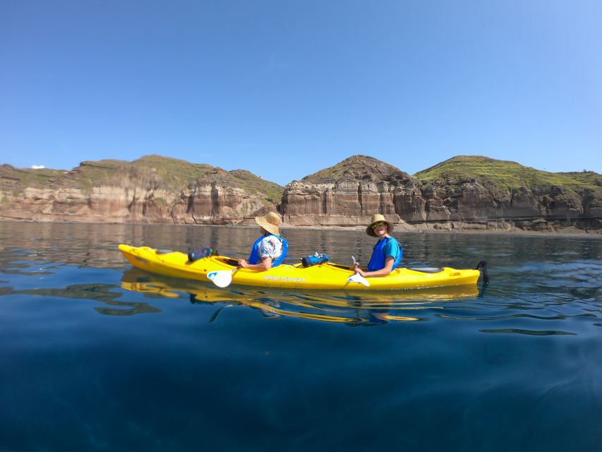Santorini: Sea Caves Kayak Trip with Snorkeling and Picnic - Entering the sea caves near Akrotiri