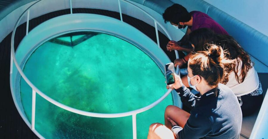 São Miguel: Glass Bottom Boat Tour with Snorkeling - Riding above the protected islet