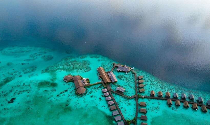 Semporna: Mabul and Kapalai Trip in Snorkel or Dive & Lunch - Mabul’s bungalows, water village, and photo stop
